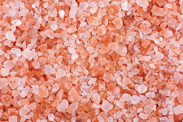 Pink himalayan salt background. Close up.